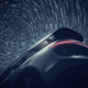 2024 Lucid Gravity rear three-quarters view with long-exposure stars in the sky